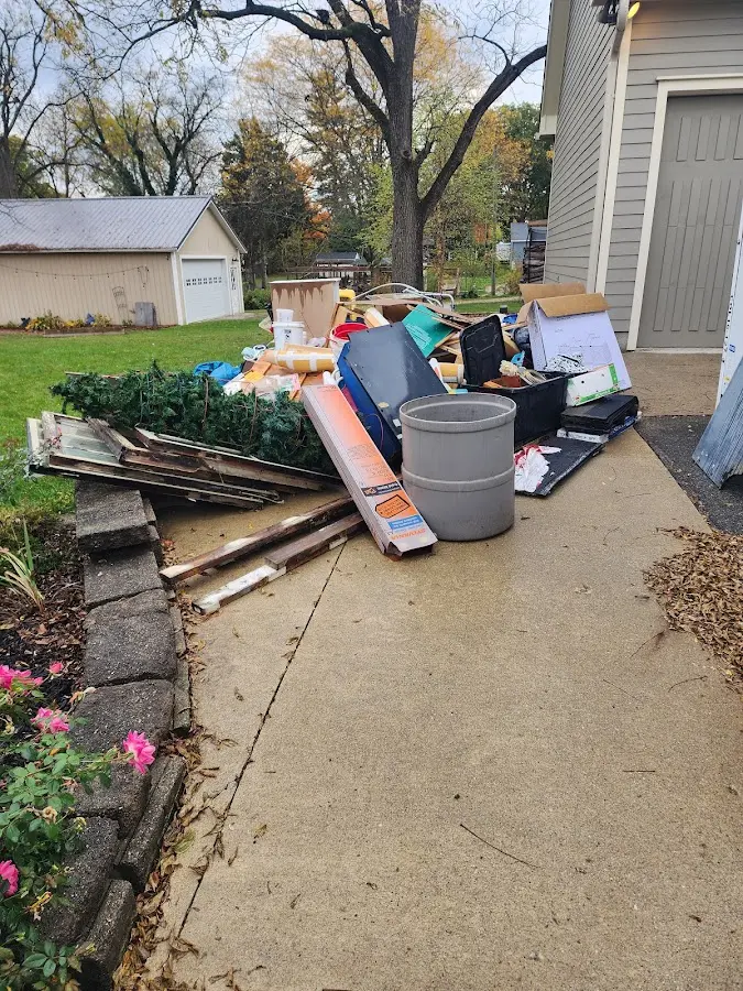 Dumpster being loaded with debris for 3 Yard Dumpster Rental in North El Monte